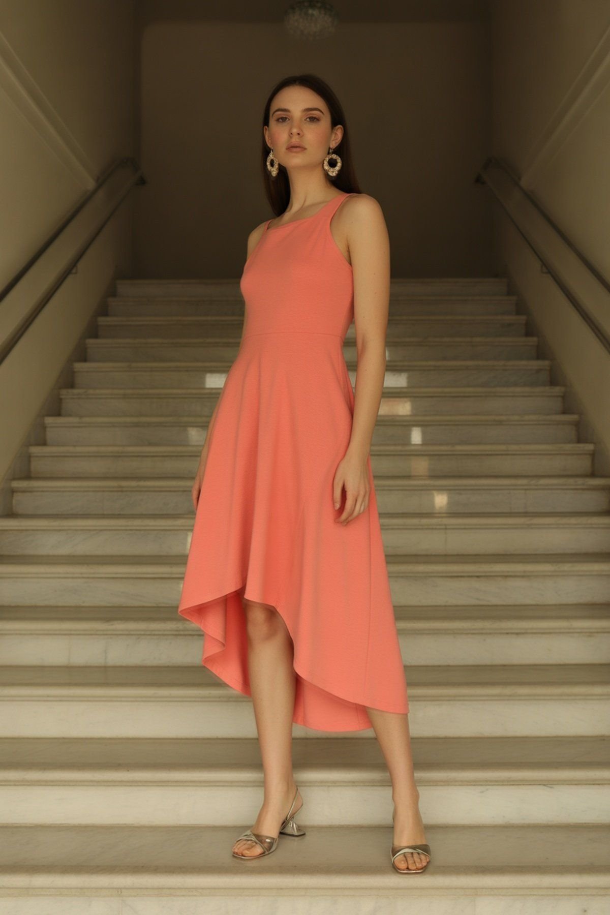 Asymmetric Hem Dress with Statement Earrings