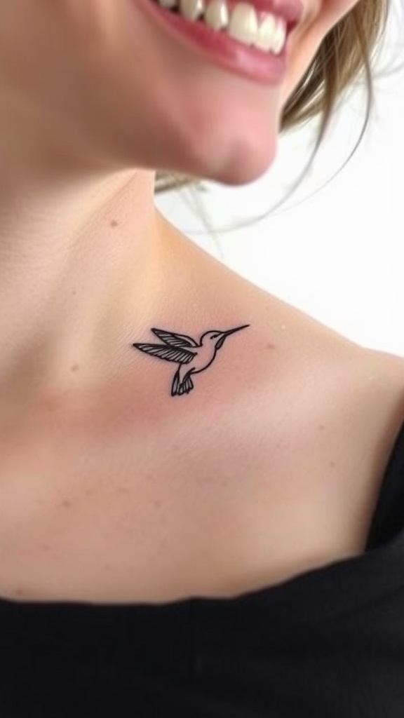 A delicate fine-line tattoo of a hummingbird on a woman's collarbone.