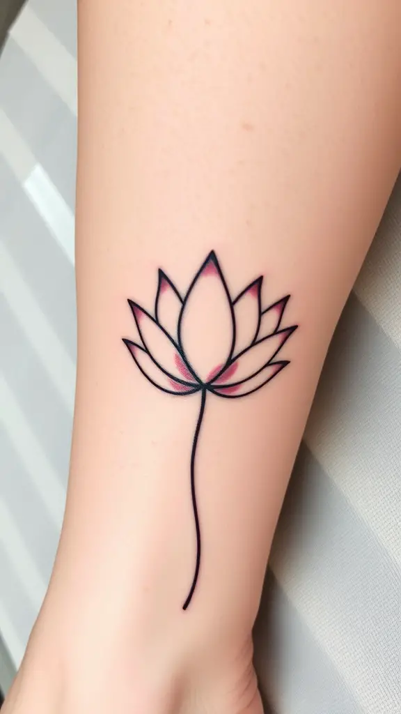 A soft lotus leaf tattoo with delicate lines on a person's arm.